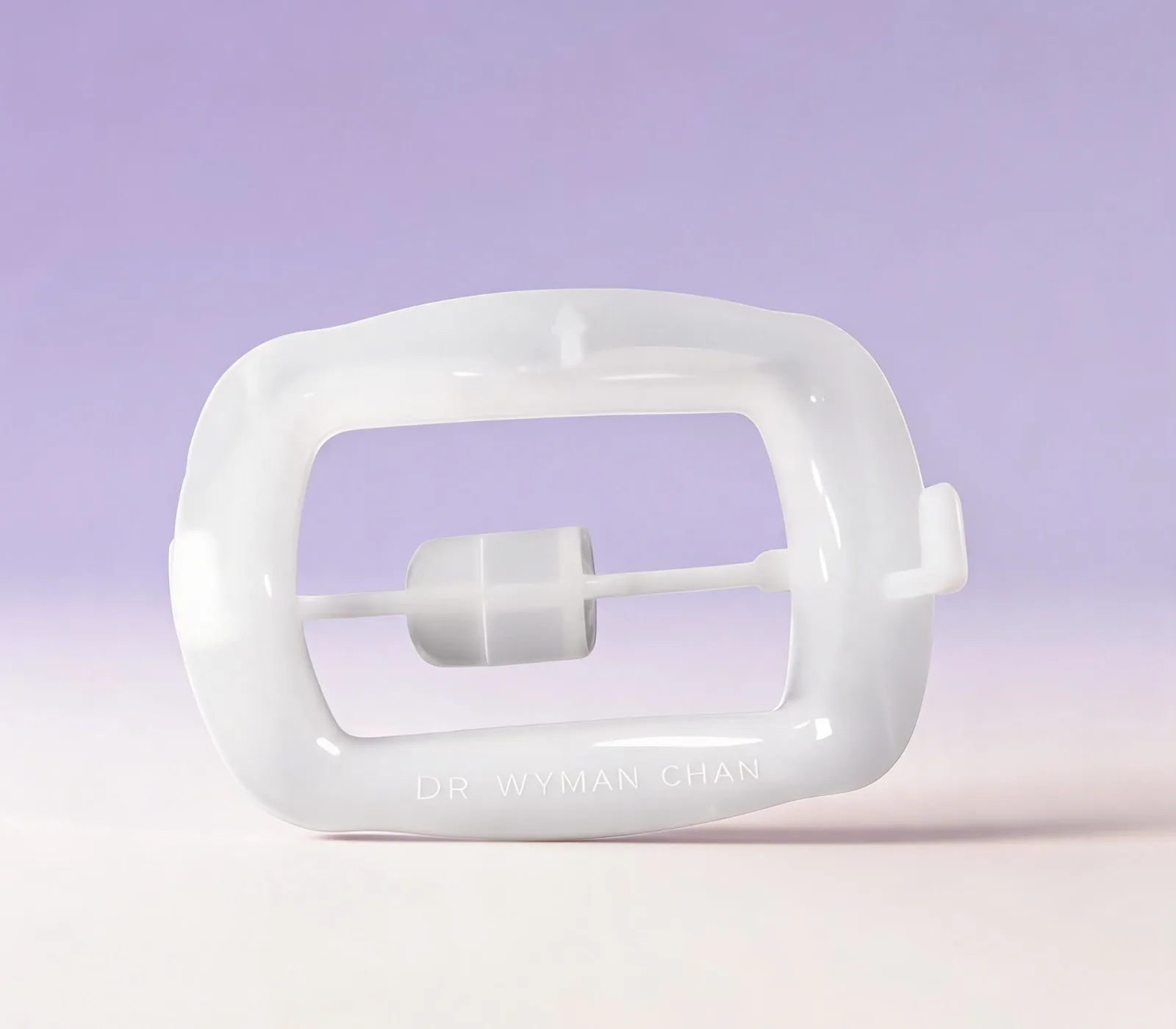 Two Wy10 O Cheek Retractors shown together: Standard and Small sizes, in translucent silicone with Dr Wyman Chan embossed detail